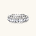 Sterling silver eternity ring with continuous row of brilliant moissanite stones in scalloped crown setting with milgrain detail